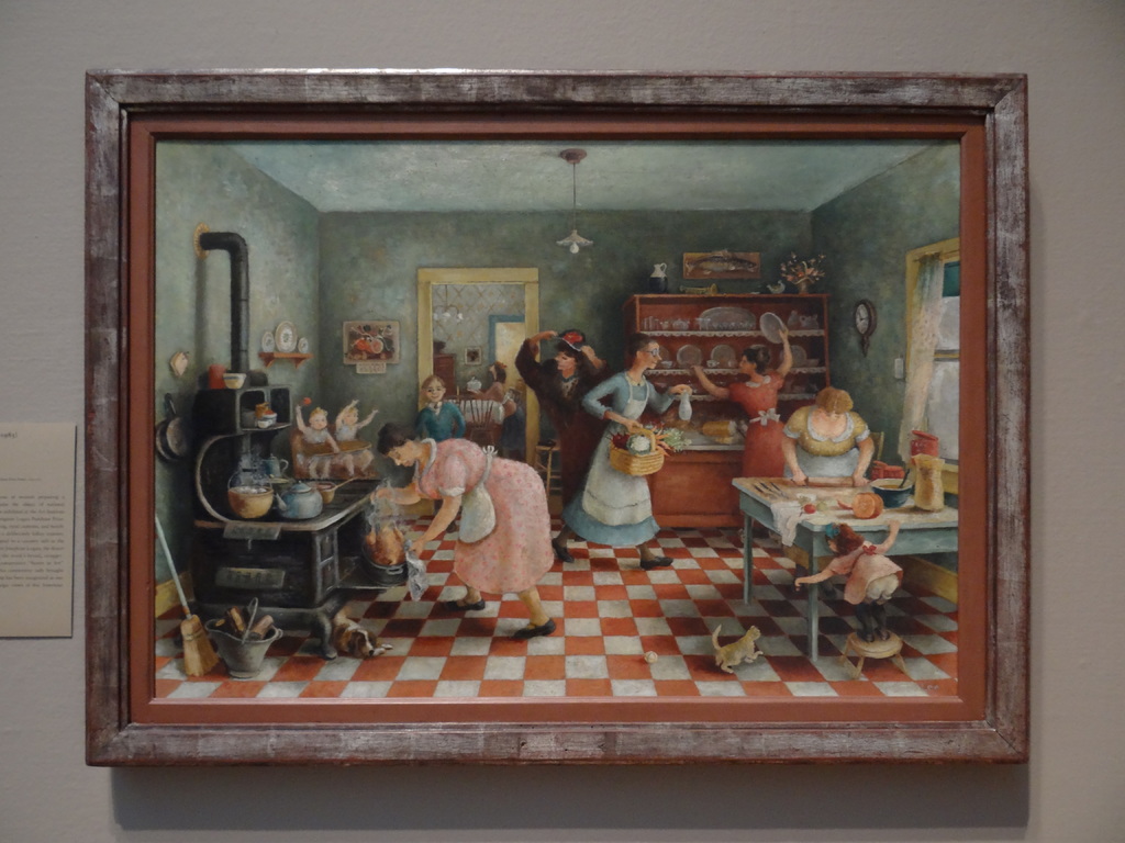 Ein Foto Rahmen an einer Wand, der ein Gemälde von mehreren Frauen in einem Raum zeigt, die verschiedene Aktivitäten ausführen.