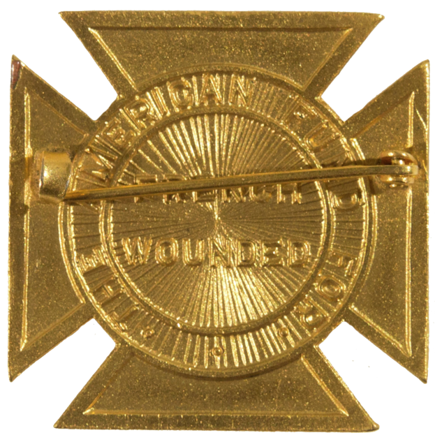 Ein goldener, sternförmiger Abzeichen mit dem Emblem der amerikanischen Feuerwache und Text in der Mitte.