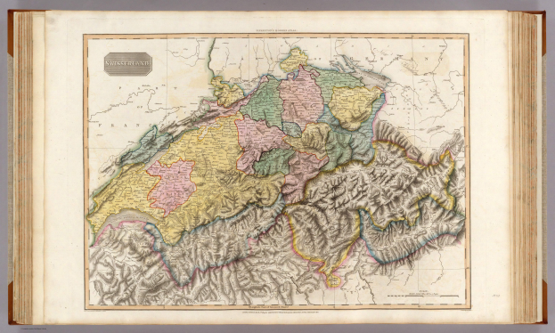 Ein altes Buch mit einer detaillierten Landkarte der Schweiz, die verschiedene Länder und Regionen zeigt, mit begleitendem Text, der zusätzliche Informationen bietet.