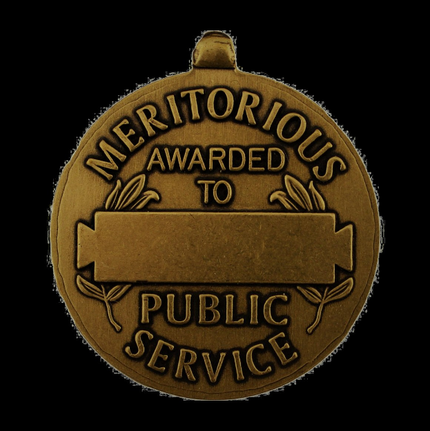 Eine bronzen Medaille mit der Inschrift "Verdienstvoll für den öffentlichen Dienst" vor einem weißen Hintergrund.