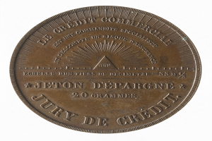 Bronzene Medaille mit der Aufschrift 'Jury de Credit' vor einem weißen Hintergrund.